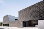 KWK Promes designs a Polish pipe distribution facility to look like a stack of aluminum tubes