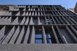 Moto Designshop screens a residence in Philadelphia with angled brick fins to create privacy