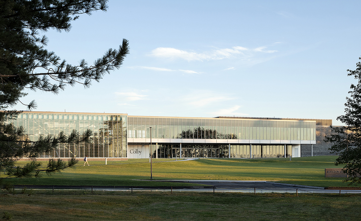A squat, glass clad center at colby college