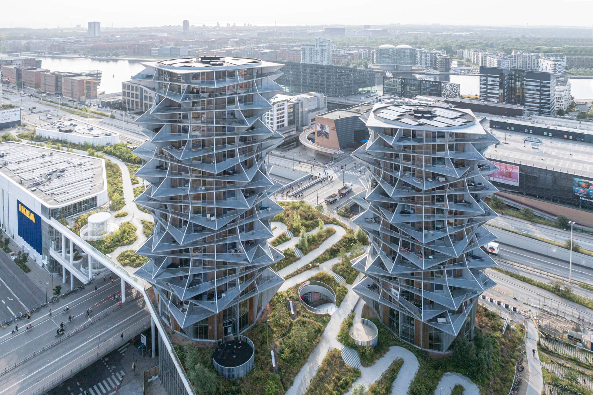 BIG alternates balcony types to form the jagged, illusory Kaktus Towers in Copenhagen